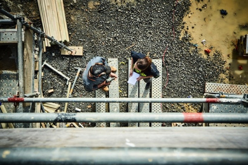Aerial image of 2 people on a building site