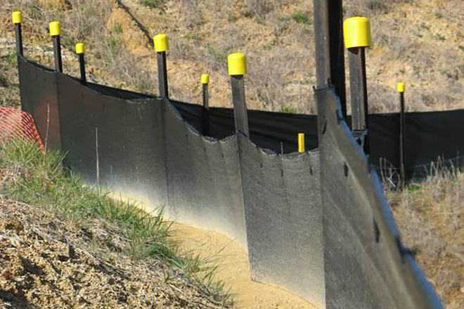 Example of a silt fence on the downhill side