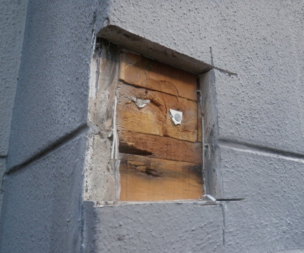 Photo showing an example of water ingress behind cladding.
